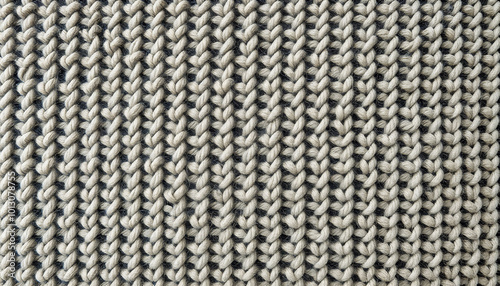 Close-up of knitted texture in beige and gray tones with cozy design, coarse wool texture