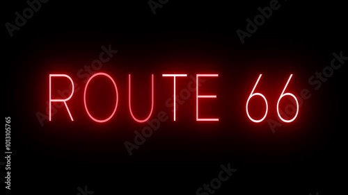 Flickering red retro style neon sign glowing against a black background ROUTE 66