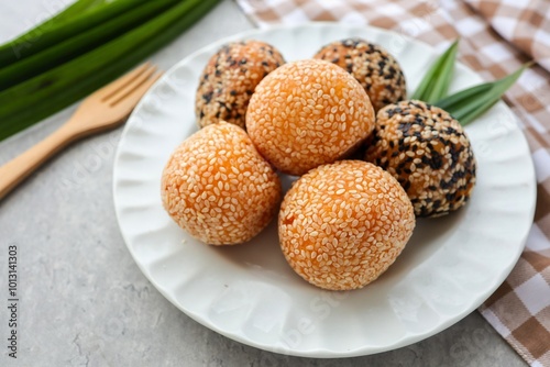 Photos Sesame Balls,Bánh cam,Kuih Bom Keledek in white plate on cement background