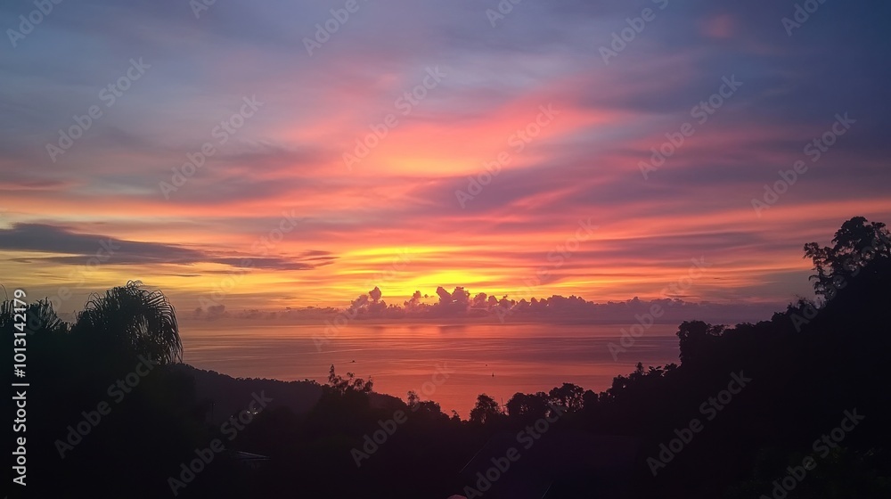 A stunning sunset view from a cliffside viewpoint in Satun, with vibrant colors painting the sky. A stunning sunset view from a cliffside viewpoint in Satun, with vibrant colors painting the sky.