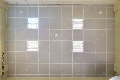 Wallpaper Mural cassette stretched or suspended ceiling with square halogen spots lamps and drywall construction in empty room in house or office. Looking up view Torontodigital.ca