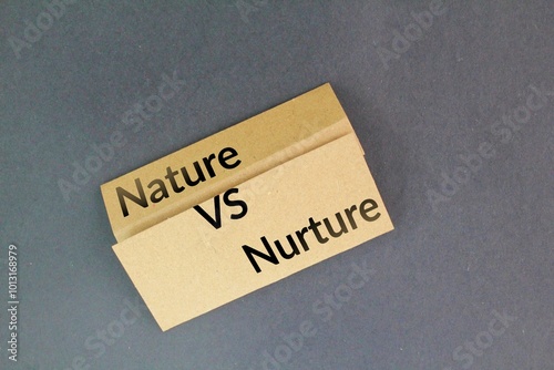 Nature versus nurture. paper with the words nature vs nurture. the environment is what makes us who we are photo