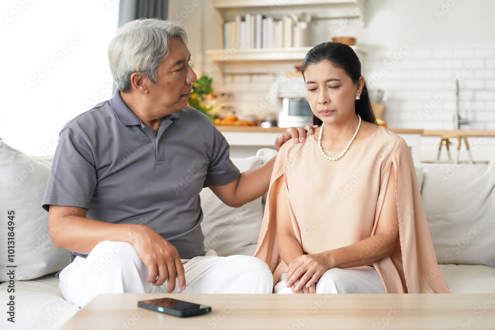 Asia senior elderly man comforting him wife after having problems relationship. Family after elderly concerned about healthy care. Family and Health care Concept Asia senior elderly man comforting him wife after having problems relationship. Family after elderly concerned about healthy care. Family and Health care Concept
