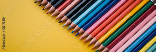 Colorful Collection of Pencils on Yellow Background