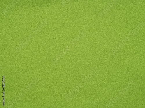 Vibrant green felt canvas, bursting with the energy of lush meadows in the heart of summer