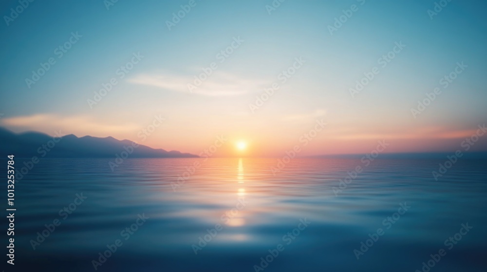 Fototapeta premium Sunset over ocean with mountains