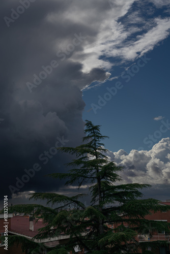 storm clouds and blue sky over the city