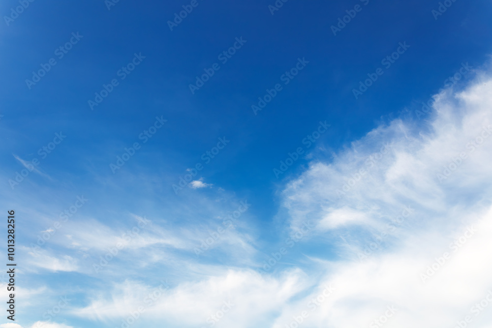 Fototapeta premium Soft gentle blue sky with light clouds. Calm texture. Nature abstract background. Fresh air, weather and freedom concept.