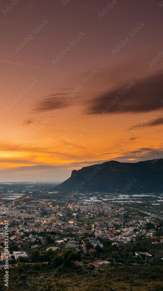 Terracina, Italy. Top View Skyline Cityscape City In Evening Sunset. City Illuminations. Time Lapse Transition From Evening Sunset To Night Terracina, Italy. Top View Skyline Cityscape City In Evening Sunset. City Illuminations. Time Lapse Transition From Evening Sunset To Night