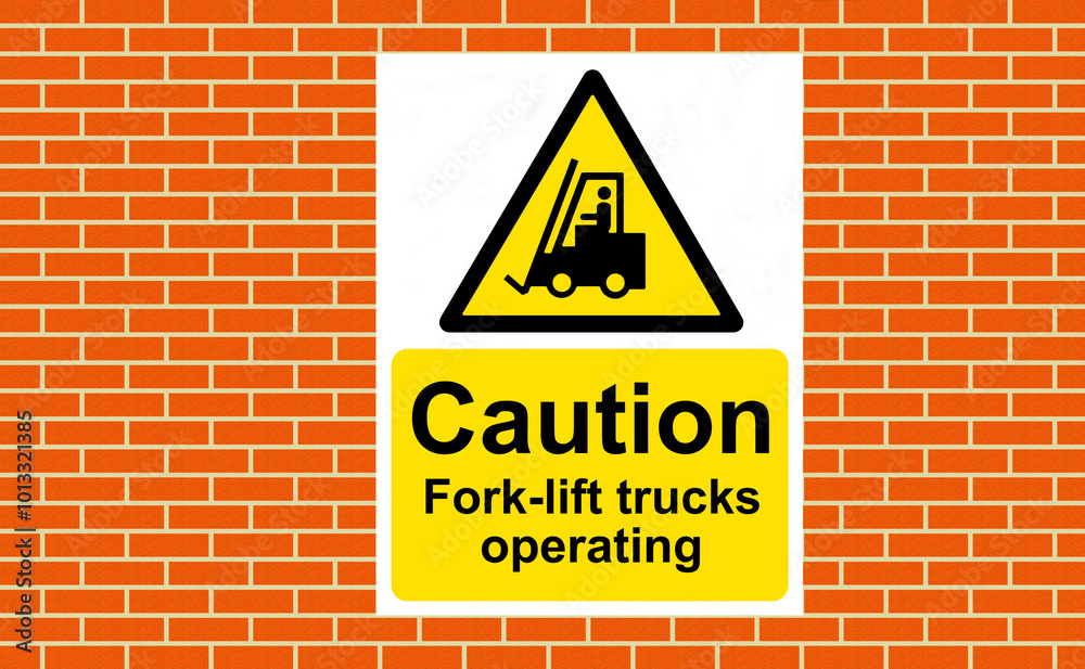 Obraz premium Caution Fork-lift trucks operating sign on a wall