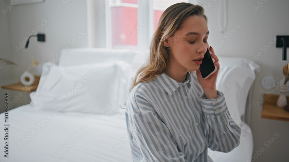 Thoughtful girl talking smartphone in home bedroom closeup. Woman calling phone Thoughtful girl talking smartphone in home bedroom closeup. Woman calling phone