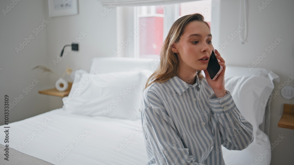 Relaxed woman answering call smartphone on apartment bed closeup. Girl talking Relaxed woman answering call smartphone on apartment bed closeup. Girl talking
