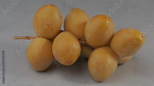 Close-up of ripe yellow dates.
