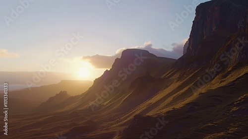 A scenic view of a mountainous landscape at sunset. The sun is shining brightly in the sky, casting long shadows across the hills.