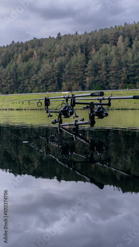 angling rods in water photo