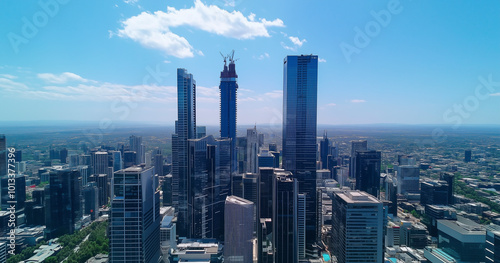 Aerial View of City Skyline and Skyscrapers Under Blue Sky and White Clouds