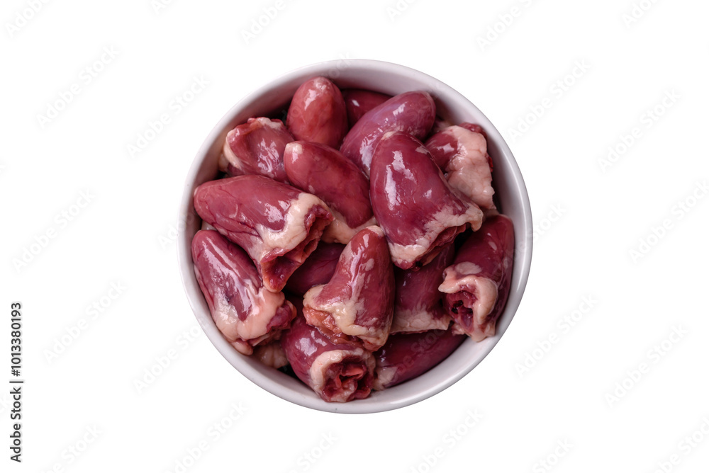 Raw chicken hearts with salt, spices and herbs Raw chicken hearts with salt, spices and herbs