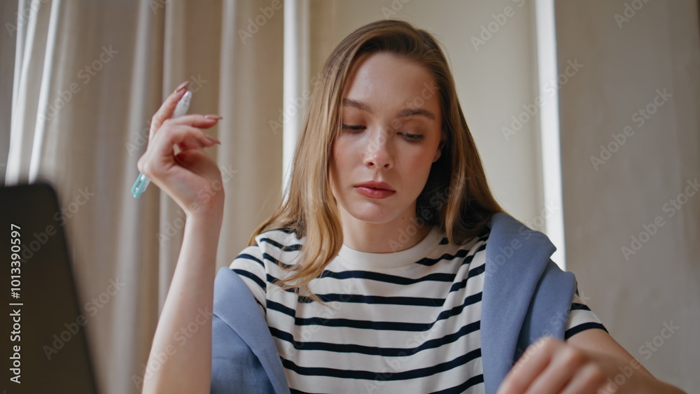 Businesswoman analyzing financial documents in office environment closeup.