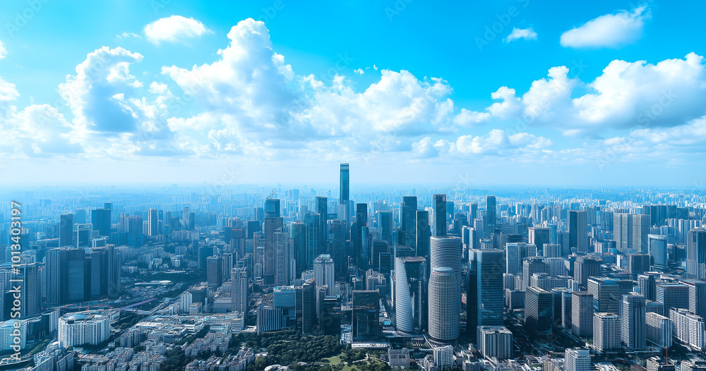 Aerial View of City Skyline and High-Rise Buildings Under Blue Sky and White Clouds