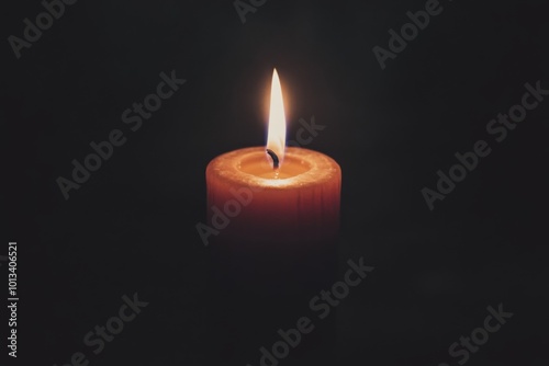 Single Candle Flame in Darkness