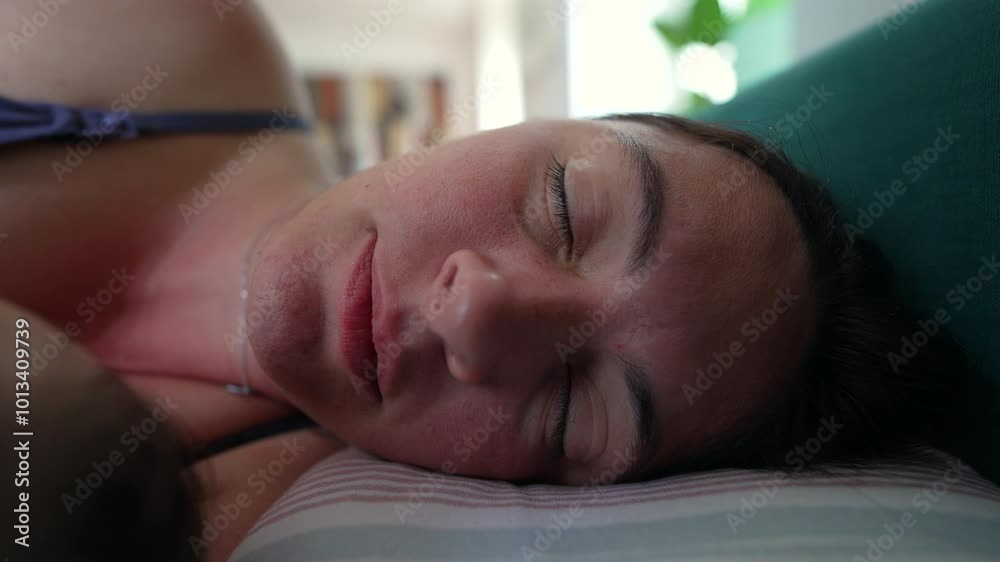 Woman sleeping soundly on a pillow with eyes closed, resting indoors in a relaxed and peaceful manner, showcasing a moment of tranquility and quiet Woman sleeping soundly on a pillow with eyes closed, resting indoors in a relaxed and peaceful manner, showcasing a moment of tranquility and quiet