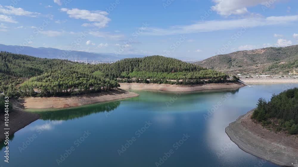 4K aerial drone view. Reflection of the cloud over the lake water.