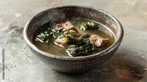 Traditional korean sogogi miyeok guk  tender beef and seaweed soup in a minimalist setting photo