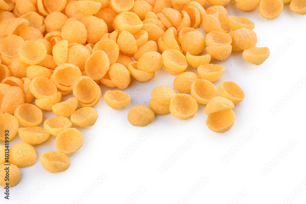 corn snack cheese flavor top view in shell-shaped corner isolated background portion spread close-up corn snack cheese flavor top view in shell-shaped corner isolated background portion spread close-up
