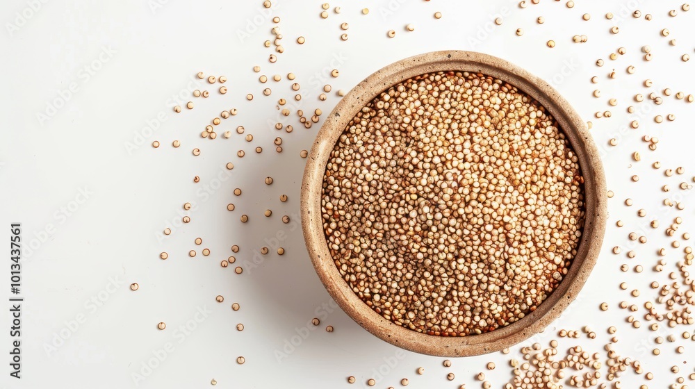 A bowl of quinoa is sitting on a white background
