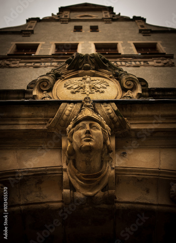 Facade Sculpture of a Woman's Head at the Entrance