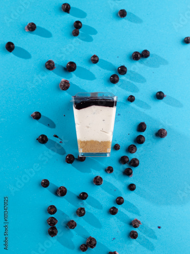 cake in a plastic cup on a blue background 