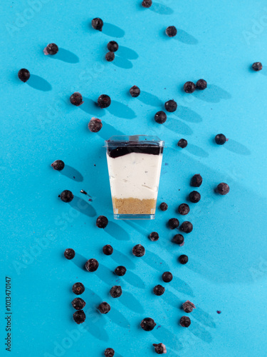 cake in a plastic cup on a blue background 