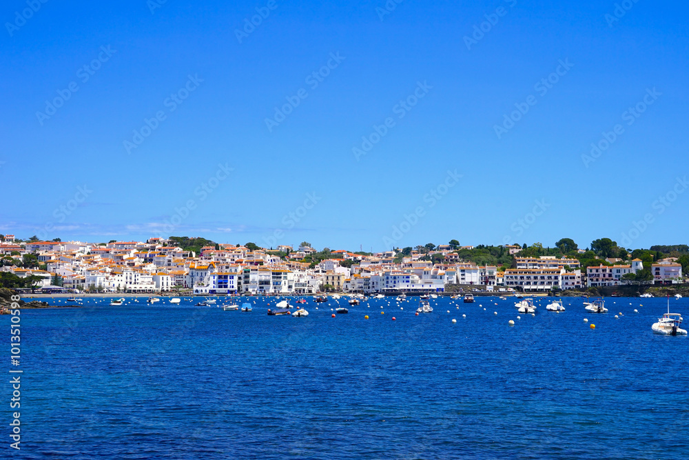view over the Badia de Cadaqués, to the beautiful white houses of Cadaqués, Port Alguer and the turquoise water of the Mediterranean Sea, mountains of the Pyrenees behind, Girona, Catalonia, Spain view over the Badia de Cadaqués, to the beautiful white houses of Cadaqués, Port Alguer and the turquoise water of the Mediterranean Sea, mountains of the Pyrenees behind, Girona, Catalonia, Spain