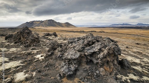 Eroded volcanic rock formations, shaped by wind and rain over centuries in a barren landscape