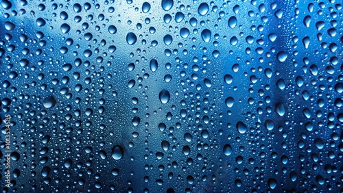 Abstract blue raindrop pattern on window