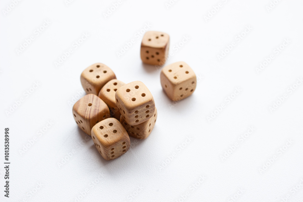 These are photos of wooden dice on a white background. They include shots of aligned, scattered, and stacked dice There are photos of a single die, a pyramid of dice. These are photos of wooden dice on a white background. They include shots of aligned, scattered, and stacked dice There are photos of a single die, a pyramid of dice.