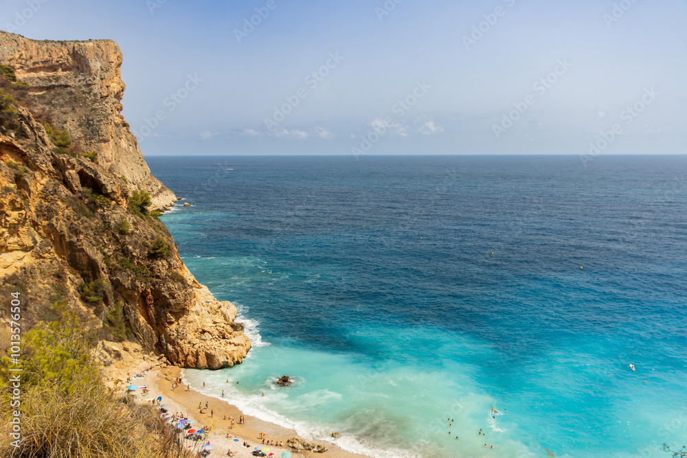 Cliffside Beach Background with Turquoise Sea, Playa de Benitachell Cliffside Beach Background with Turquoise Sea, Playa de Benitachell
