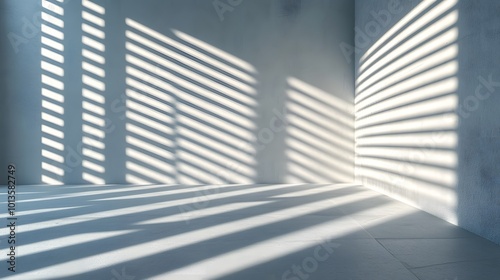 White Venetian blinds filter soft light, casting geometric shadow patterns on a wall, creating a serene ambiance in a minimalist interior characterized by clean lines and tranquil mood.