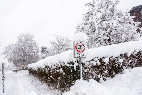 Sign covered in snow