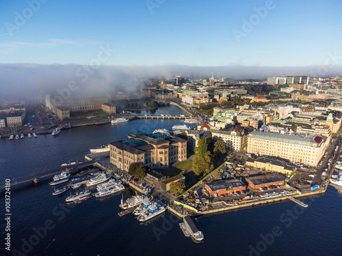 Photography Fog rolling in over the royal palace and the old city of Stockholm, aerial view