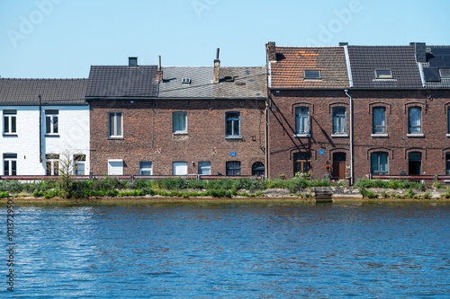 Haccourt, Ouepeye, Belgium, AUG 11, 2024 - Modest brick stone houses at the banks of the Albert Canal photo