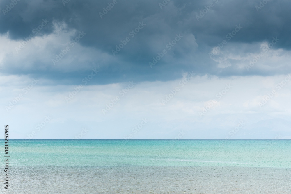 Rain clouds over emerald sea in Corfu, Greece Rain clouds over emerald sea in Corfu, Greece