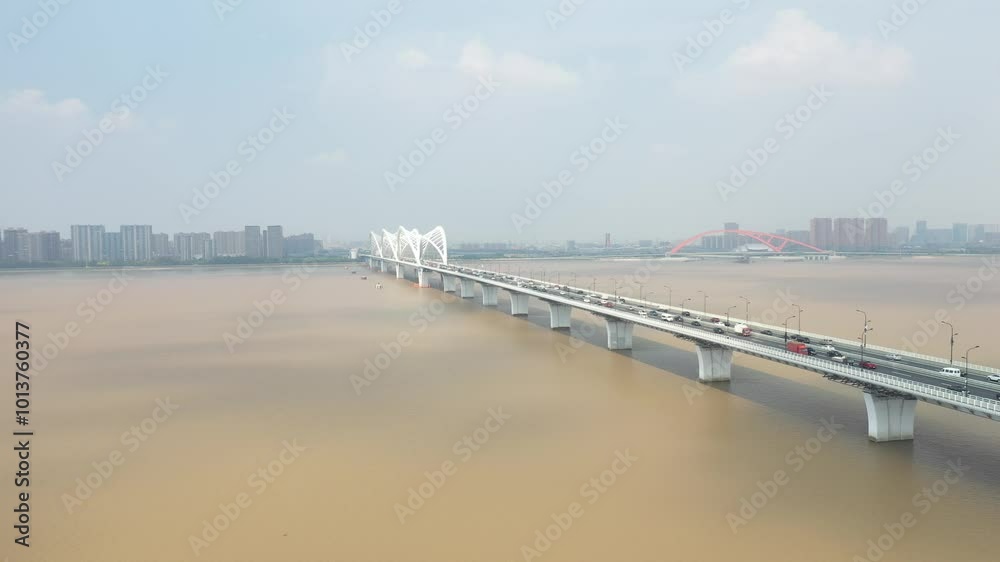 Aerial view of the Qiantang River tidal bore and the Qiantang River Bridge in Hangzhou, Zhejiang, China Aerial view of the Qiantang River tidal bore and the Qiantang River Bridge in Hangzhou, Zhejiang, China