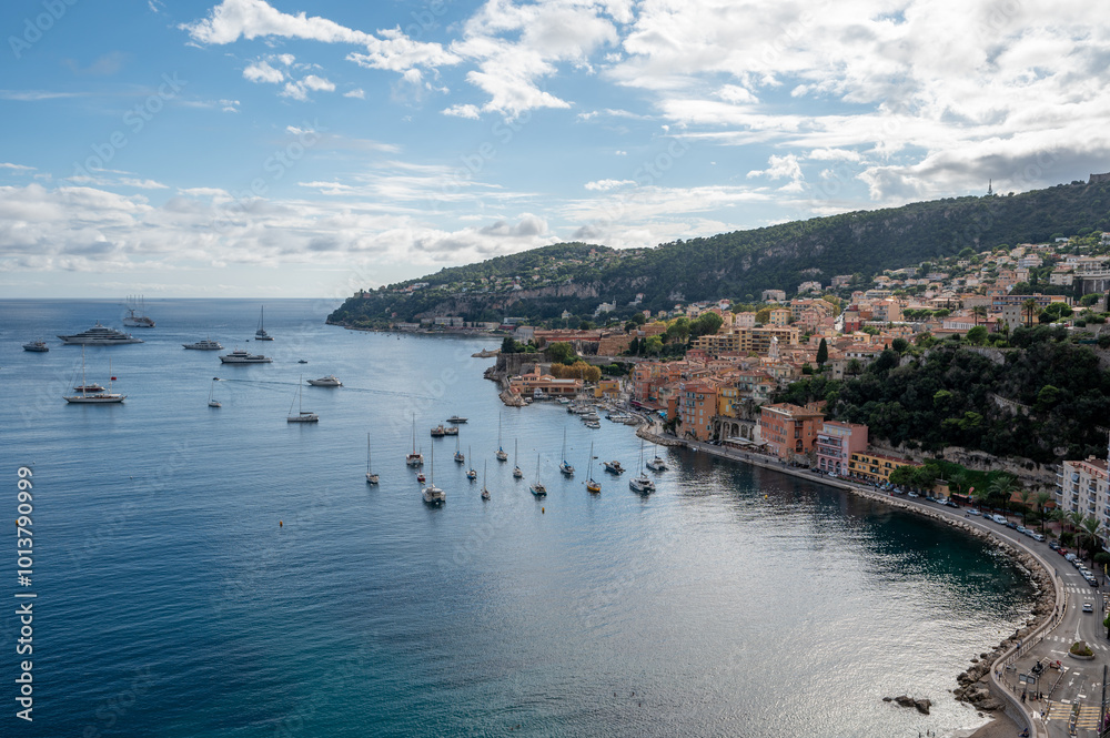 Fototapeta premium Yachts at anchor in natural harbor of Villefranche-sur-Mer on sunny summer afternoon.