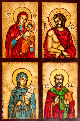 Tablou pe pânză Colorful religious icon featuring four panels, each depicting a different saint in traditional Byzantine style