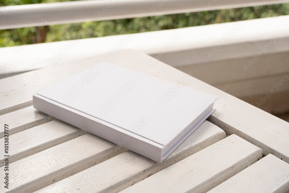 blank book cover mockup on wooden outdoor table, hotel balcony or terrace blank book cover mockup on wooden outdoor table, hotel balcony or terrace