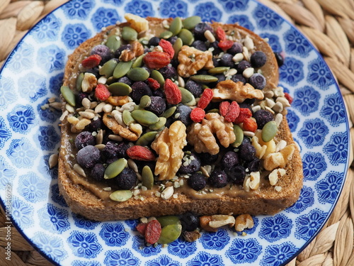 Sandwich with peanut butter, nuts and berries