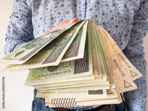 Rich male holds and count 100 200 zloty pln zl banknotes. Polish currency