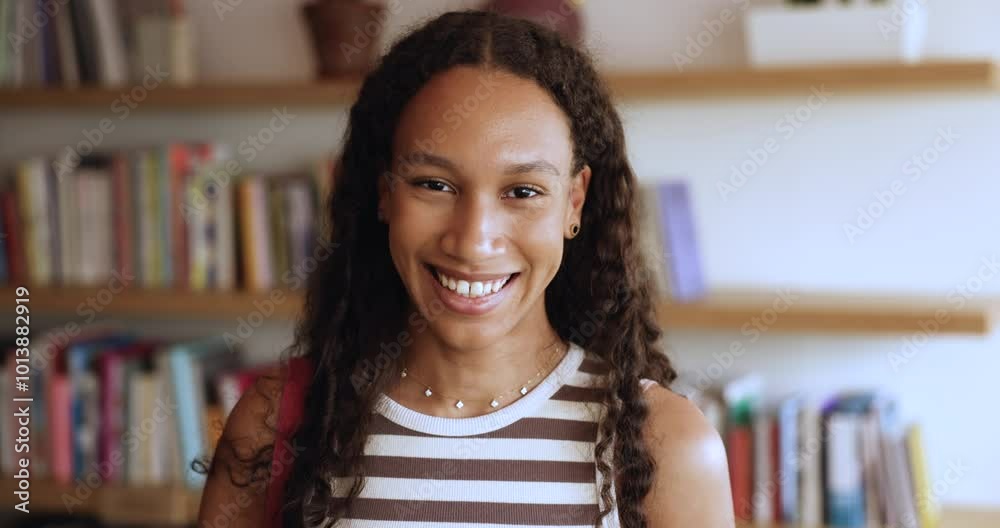 Serious beautiful long curly haired teenage African student girl posing ...