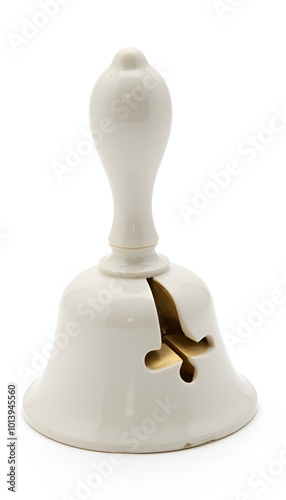 White porcelain bell with a decorative handle, isolated on a white background